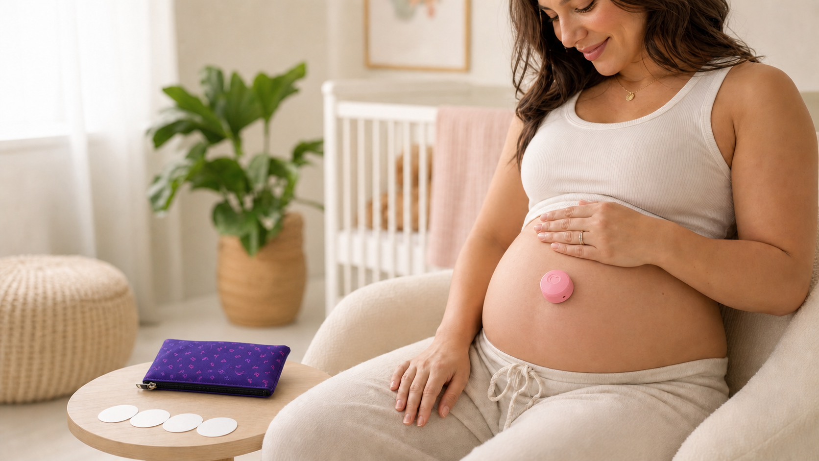 Pregnant woman wearing the pink Bump Up the Jam AirPod holder on her belly